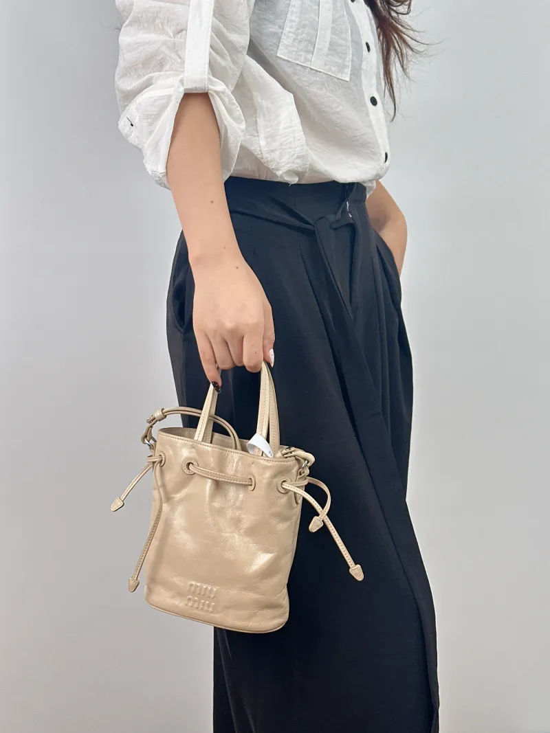 Miumiu Crossbody Bag Bucket Bag Taupe Calfskin 15.5 × 8.5 × 18 cm — on-model view 2 of 2