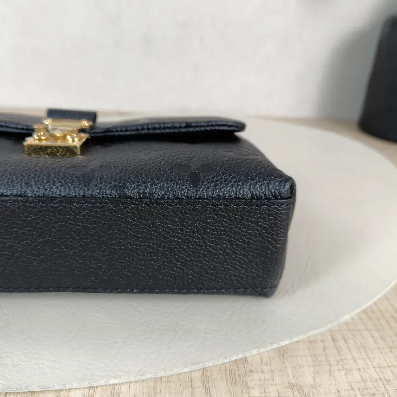 Louis Vuitton Crossbody Bag MADELEINE Black Monogram Empreinte Embossed Calfskin nano 21 × 6 × 12.5 cm — detail view 3 of 12