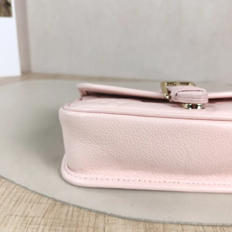 Louis Vuitton Crossbody Bag Diane Baguette Bag Monogram Empreinte Embossed Calfskin nano 19 × 6 × 10.5 cm — detail view 11 of 13