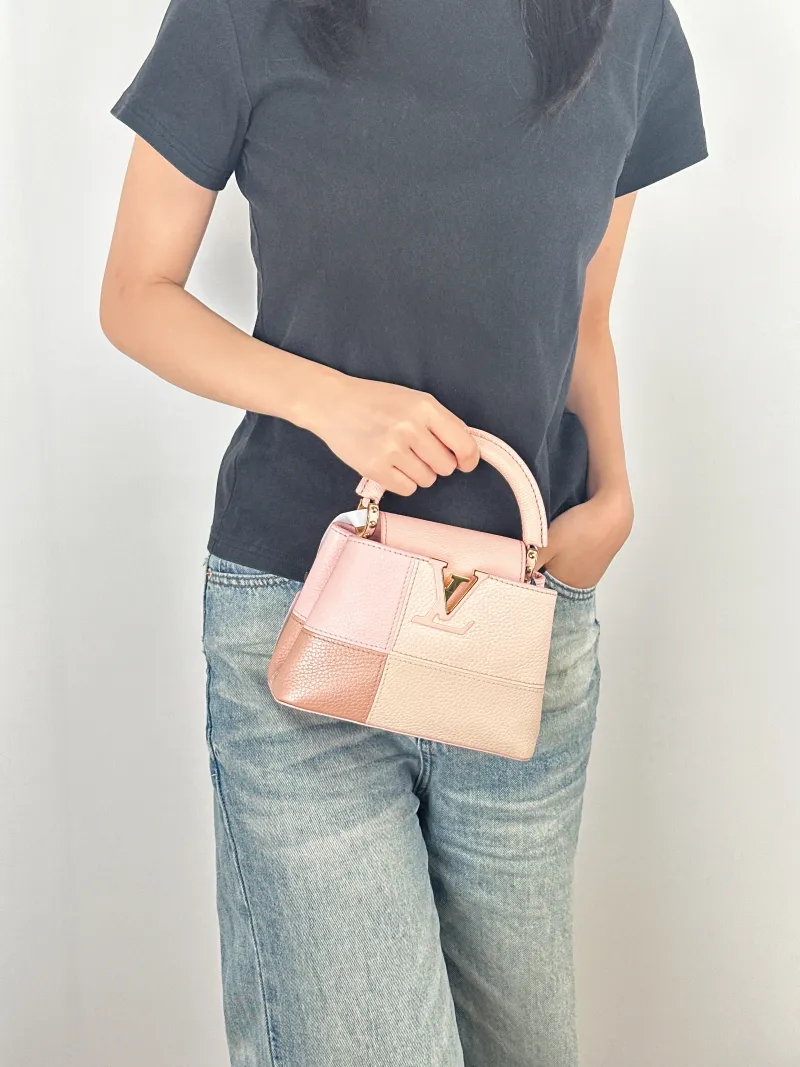 Louis Vuitton Crossbody Bag Capucines Pink Colorblock Calfskin · mini21 × 8 × 14 cm — on-model view 1 of 3
