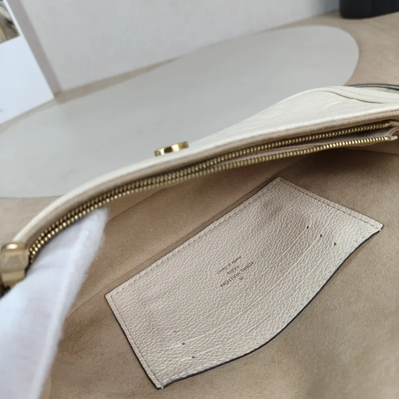 Louis Vuitton Crossbody Bag IVY White Monogram Empreinte Embossed Calfskin Small 23.5 × 4.3 × 12 cm — detail view 6 of 11