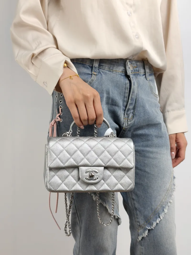 Chanel Crossbody Bag mini Silver Grained Calfskin mini 20 × 6 × 12 cm 30 — on-model view 3 of 3