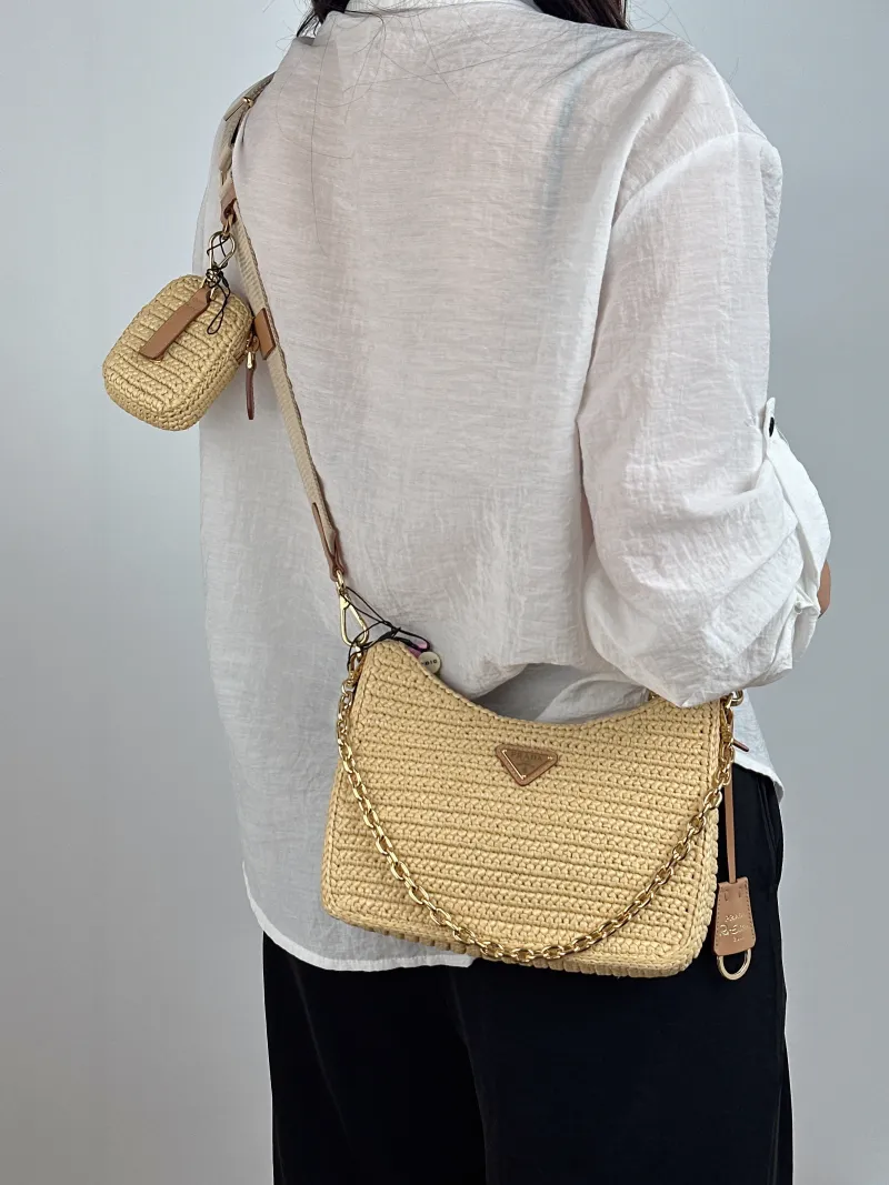 PRADA Crossbody Bag Re-Edition 2005 Hobo Woven Mini 22 × 6 × 18 cm — on-model view 2 of 2