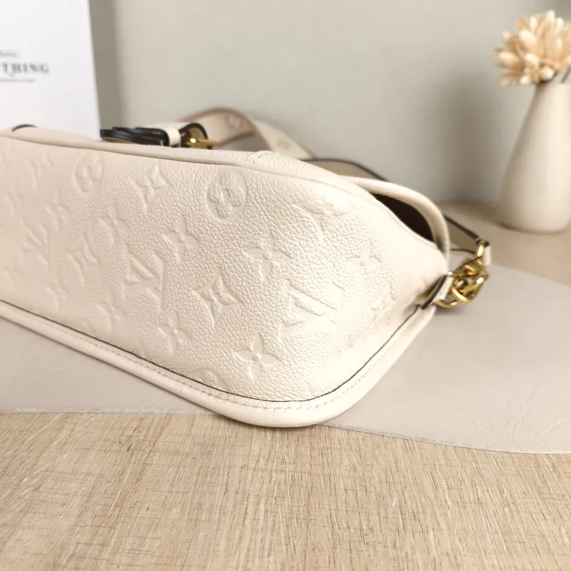 Louis Vuitton Crossbody Bag Diane Baguette Bag White Empreinte Embossed Calfskin Small 24 × 9 × 15 cm — detail view 1 of 11