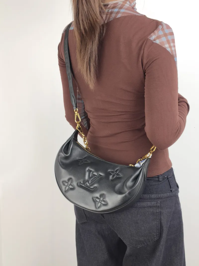 Louis Vuitton Crossbody Bag Over The Moon Black Calfskin 27.5 × 7 × 16 cm — on-model view 1 of 2