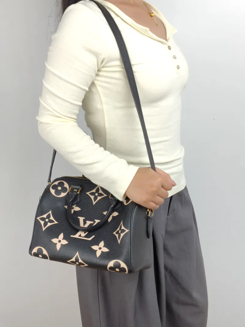 Louis Vuitton Crossbody Bag Speedy25 Black · White Monogram Empreinte Embossed Calfskin Medium 25 × 15 × 19 cm — on-model view 1 of 3
