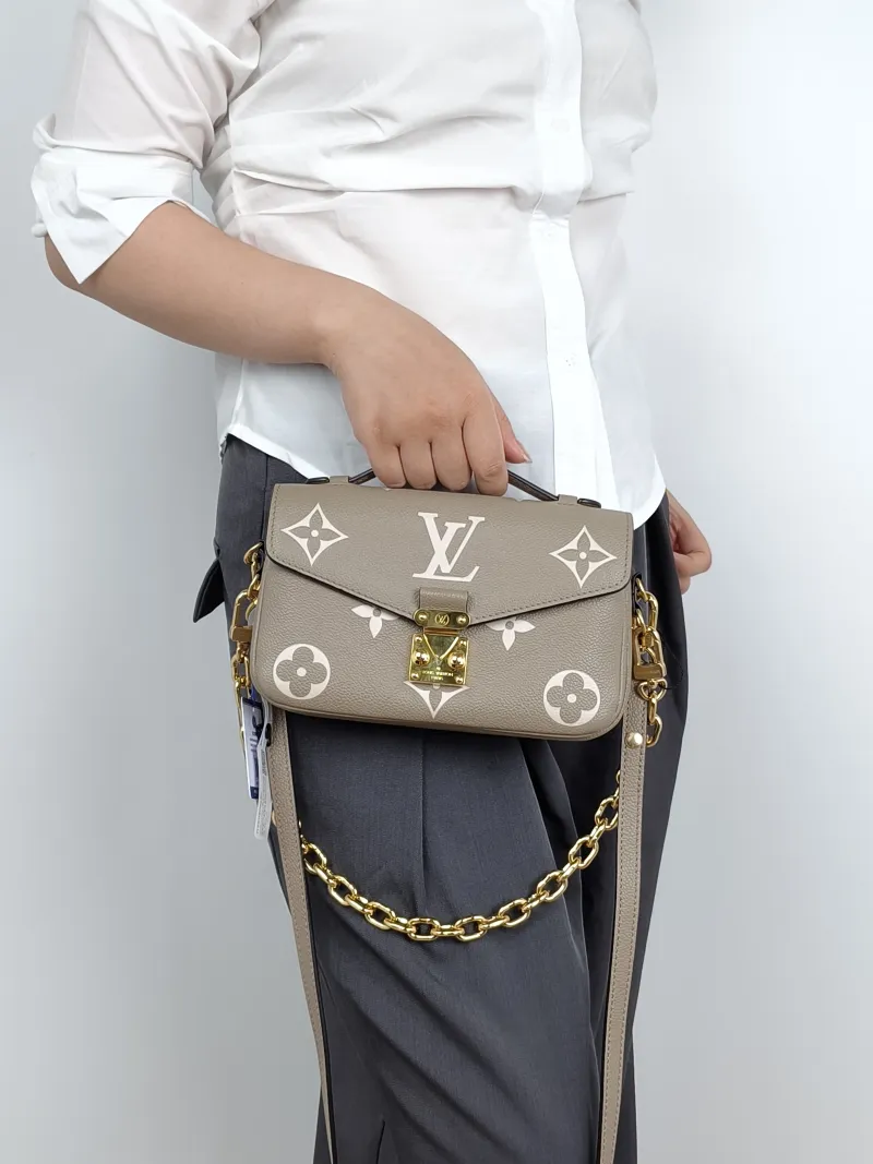 Louis Vuitton Crossbody Bag Pochette Métis East West Empreinte Embossed Calfskin Small21.5 × 6 × 13.5 cm — on-model view 1 of 3