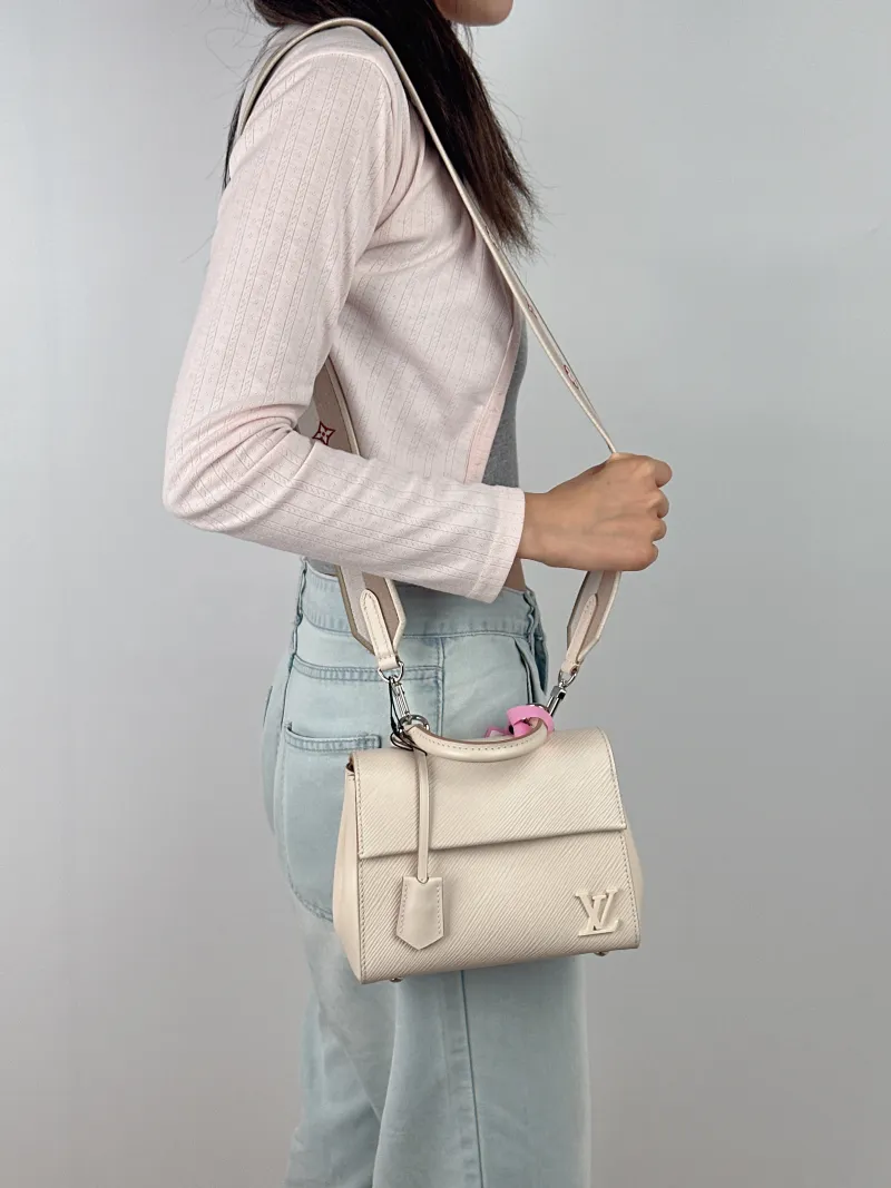Louis Vuitton Crossbody Bag CLUNY White Epi Embossed Calfskin Mini 20 × 7.5 × 16 cm — on-model view 2 of 3
