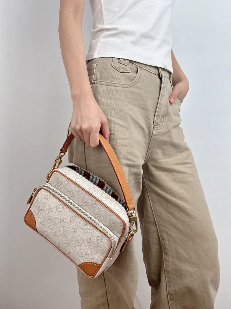 Louis Vuitton Crossbody Bag Nil Messenger Bag PVC One Size 25 × 11 × 17.5 cm — on-model view 2 of 3