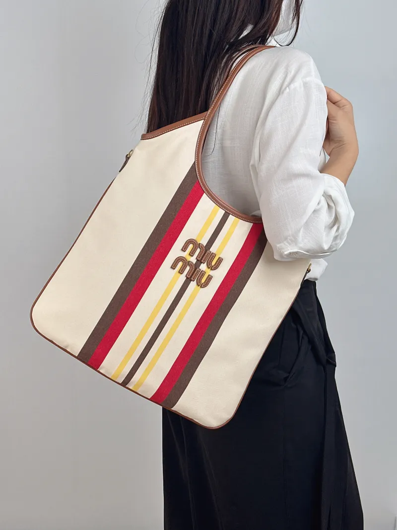 Miumiu Shoulder Bag IVY Tote Shopping Tote Canvas Medium 35*40 — on-model view 2 of 2