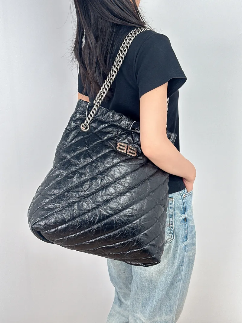 BALENCIAGA Crossbody Bag Crush Black Waxed Leather Large35 × 14 × 37 cm — on-model view 2 of 2
