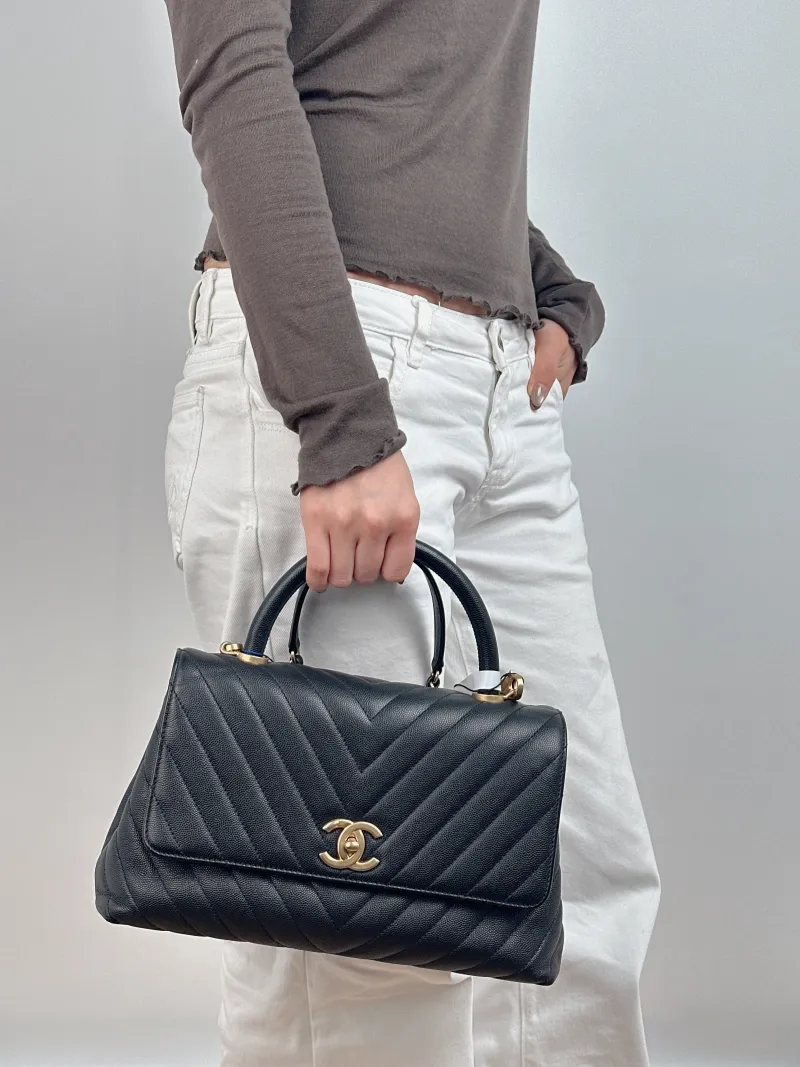 Chanel Top Handle Bag Coco Handle​ Black with Gold-Tone Hardware V Grained Calfskin Medium 29 × 12 × 18 cm 26 — on-model view 2 of 2