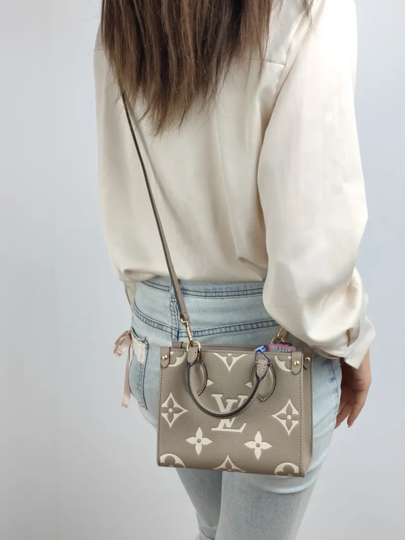 Louis Vuitton Crossbody Bag Onthego BB · White Monogram Empreinte Embossed Calfskin BB 18 × 8.5 × 15 cm — on-model view 2 of 2