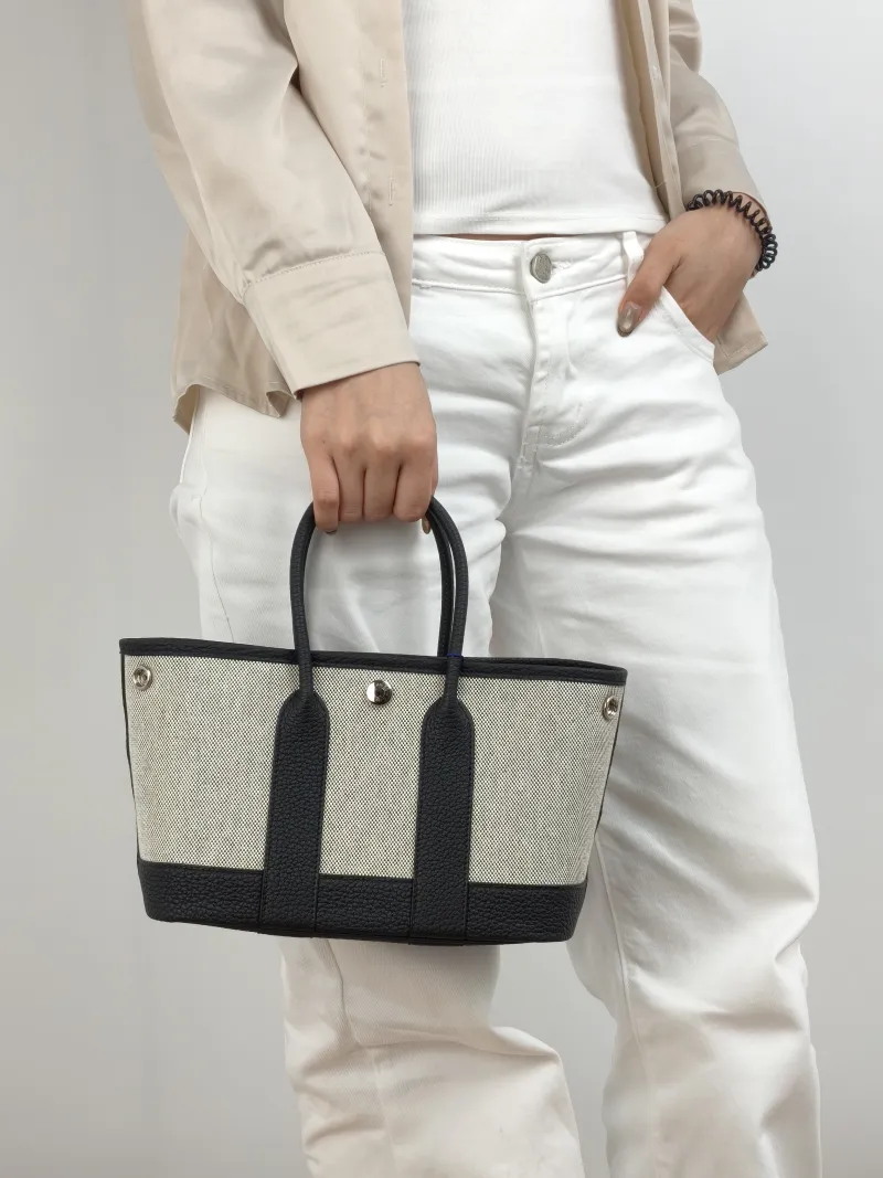 Hermès Top Handle Bag Neo Garden 23 Mini Black · Beige Canvas · Negonda Calfskin Mini 23 × 10 × 16 cm G — on-model view 2 of 2