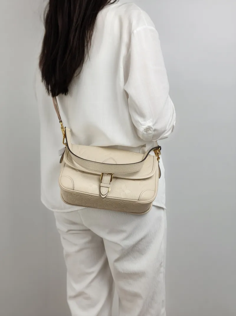 Louis Vuitton Crossbody Bag Diane Baguette Bag White Empreinte Embossed Calfskin Small 24 × 9 × 15 cm — on-model view 2 of 2