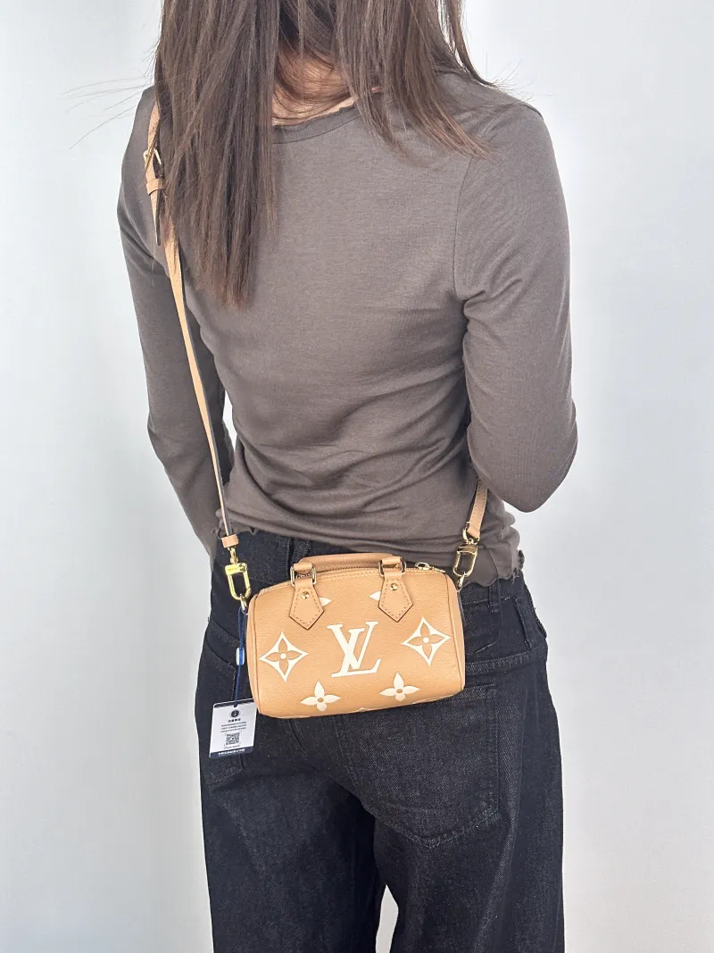 Louis Vuitton Crossbody Bag Speedy Nano · White Empreinte Embossed Calfskinnano16 × 7.5 × 10 cm — on-model view 3 of 3