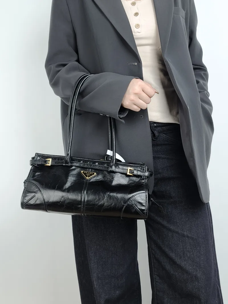 PRADA Shoulder Bag Bonnie Soft Lux Black Waxed Leather Medium 32 × 12 × 15.5 cm — on-model view 4 of 4