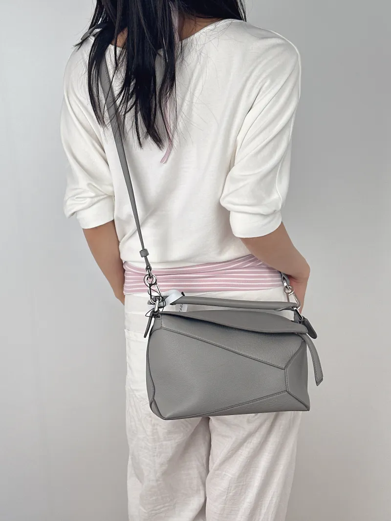 LOEWE Crossbody Bag Puzzle Grey CC alfskin Small24 × 10.5 × 16.5 cm — on-model view 1 of 3