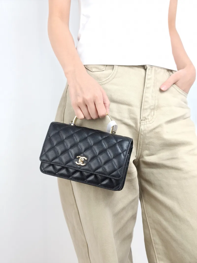 Chanel Crossbody Bag woc Black with Gold-Tone Hardware Grained Calfskin One Size 19.2 × 3.5 × 12.3 cm — on-model view 2 of 3