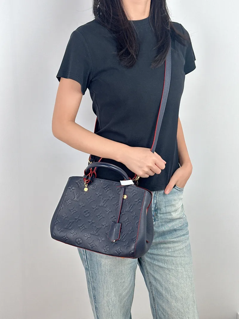 Louis Vuitton Top Handle Bag Montaigne Blue Calfskin 25 × 10 × 20 cm — on-model view 1 of 3
