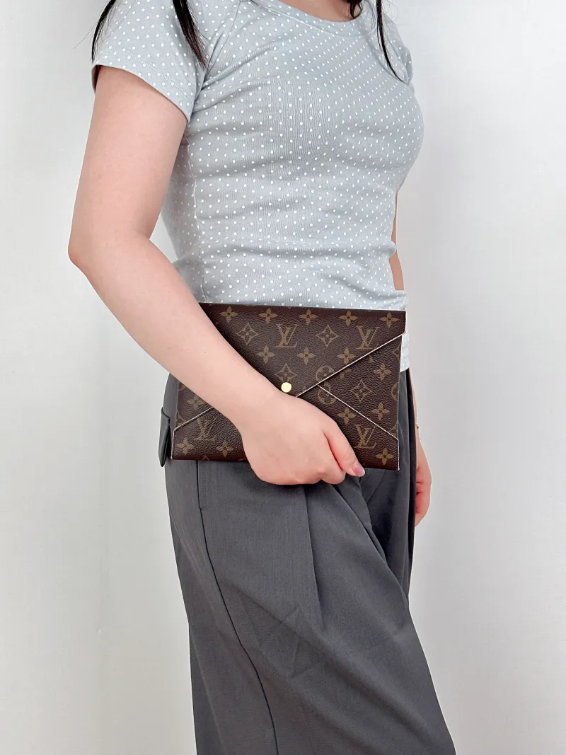 Louis Vuitton Clutch Kirigami Pochette Clutch Monogram PVC Large23 × 0.3 × 16.5 cm — on-model view 1 of 2