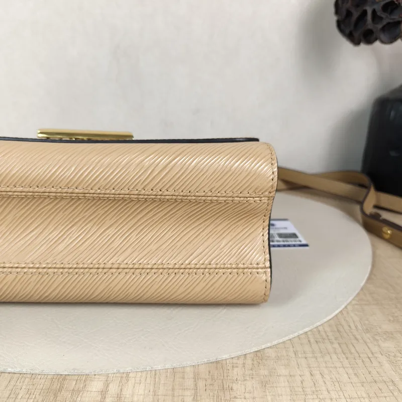 Louis Vuitton Crossbody Bag Twist Taupe Epi Embossed Calfskin Medium 23 × 9.5 × 17 cm — detail view 1 of 13