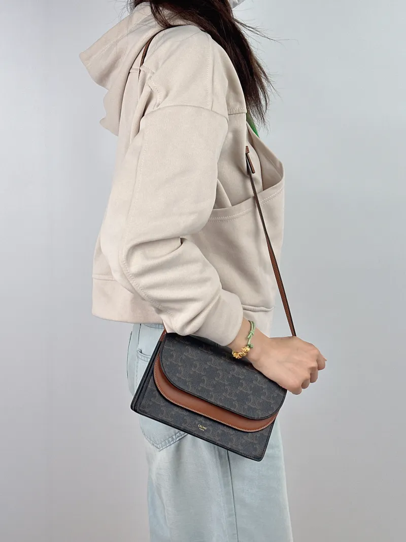 CELINE Crossbody Bag TRIOMPHE Clutchwoc Monogram PVC 20 × 6 × 12 cm — on-model view 1 of 2