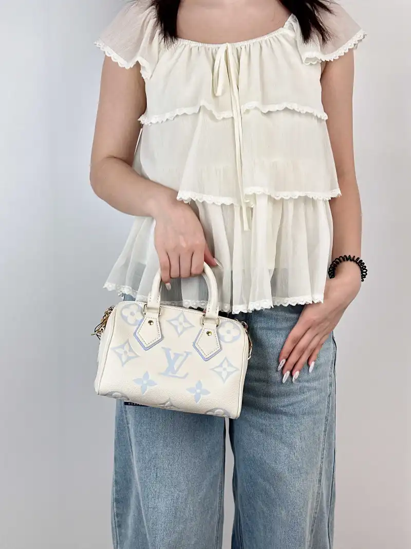 Louis Vuitton Crossbody Bag Speedy20 White · Blue Empreinte Embossed Calfskin Small 20.5 × 12 × 13.5 cm — on-model view 1 of 3