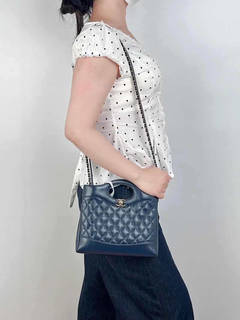 Chanel Crossbody Bag31Bag Navy Waxed Leathermini23 × 5.5 × 22 cm — on-model view 3 of 3