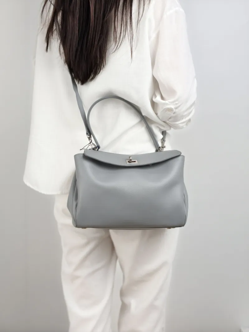 BALENCIAGA Crossbody Bag RODEO Grey Calfskin Small 27 × 10 × 20 cm — on-model view 1 of 2
