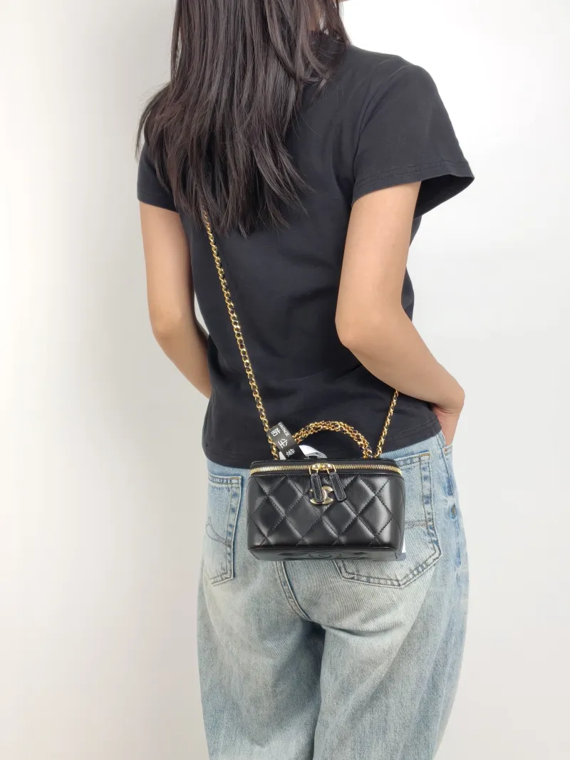 Chanel Crossbody Bag Black Lambskin Mini 16 × 8 × 9.5 cm — on-model view 1 of 3