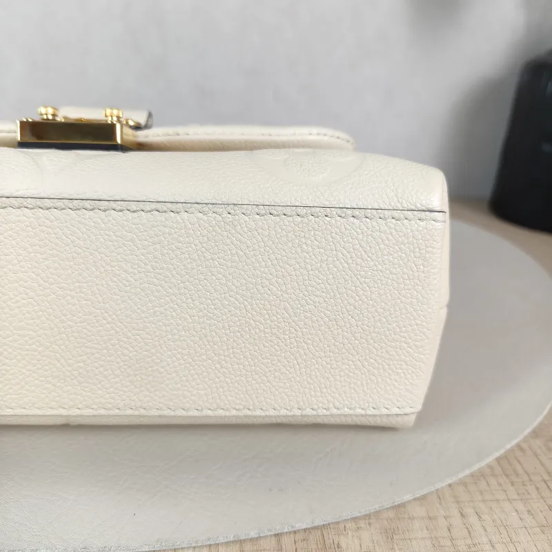 Louis Vuitton Crossbody Bag MADELEINE Beige Monogram Empreinte Embossed Calfskin BB 24 × 8.5 × 17 cm — detail view 4 of 12