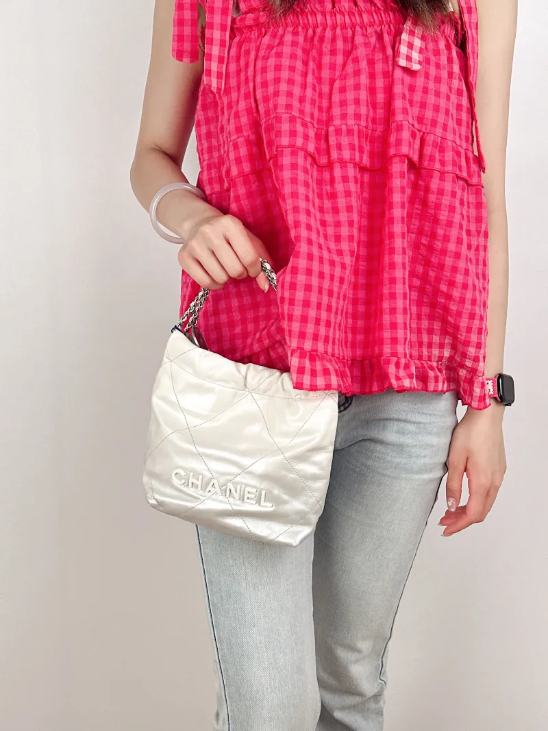 Chanel Shoulder Bag22Bag White CC alfskinmini20 × 6 × 19 cm — on-model view 1 of 3