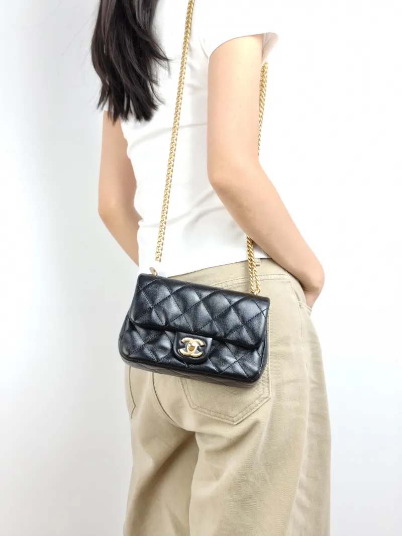 Chanel Crossbody Bag Black with Gold-Tone Hardware Lambskin Mini 18 × 5 × 12 cm — on-model view 2 of 2