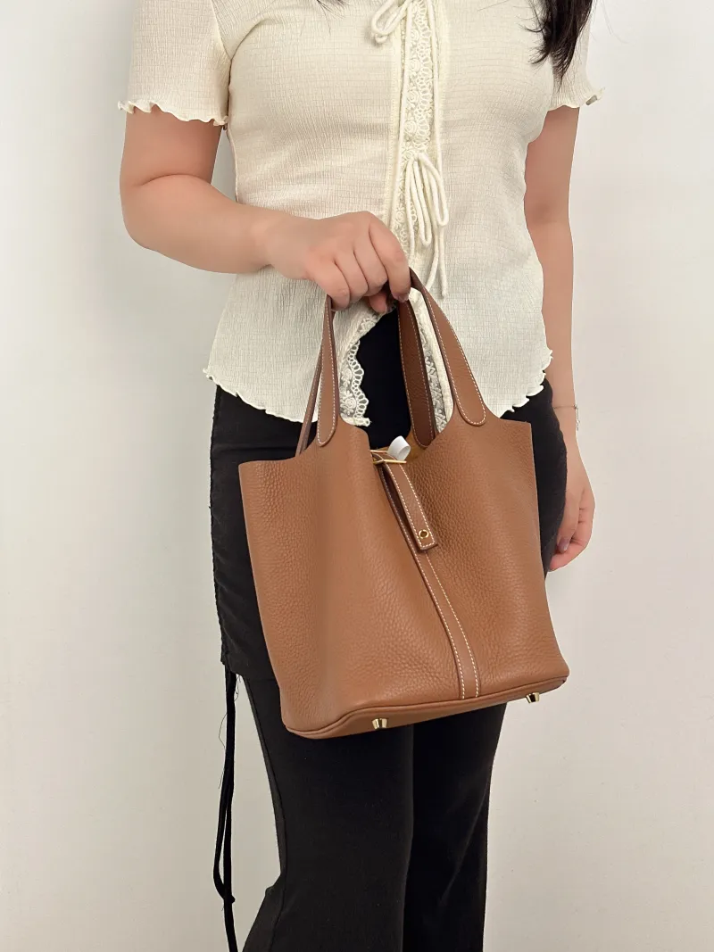Hermès Top Handle Bag Picotin Lock 22 22 Clemence Taurillon TC Calfskin Medium22 × 18 × 21 cm — on-model view 1 of 2