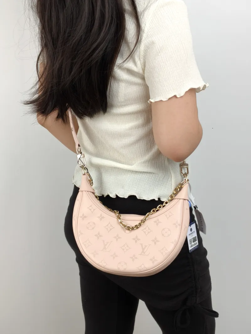 Louis Vuitton Crossbody Bag Loop Pink Calfskin Small 23 × 6 × 13 cm — on-model view 1 of 3