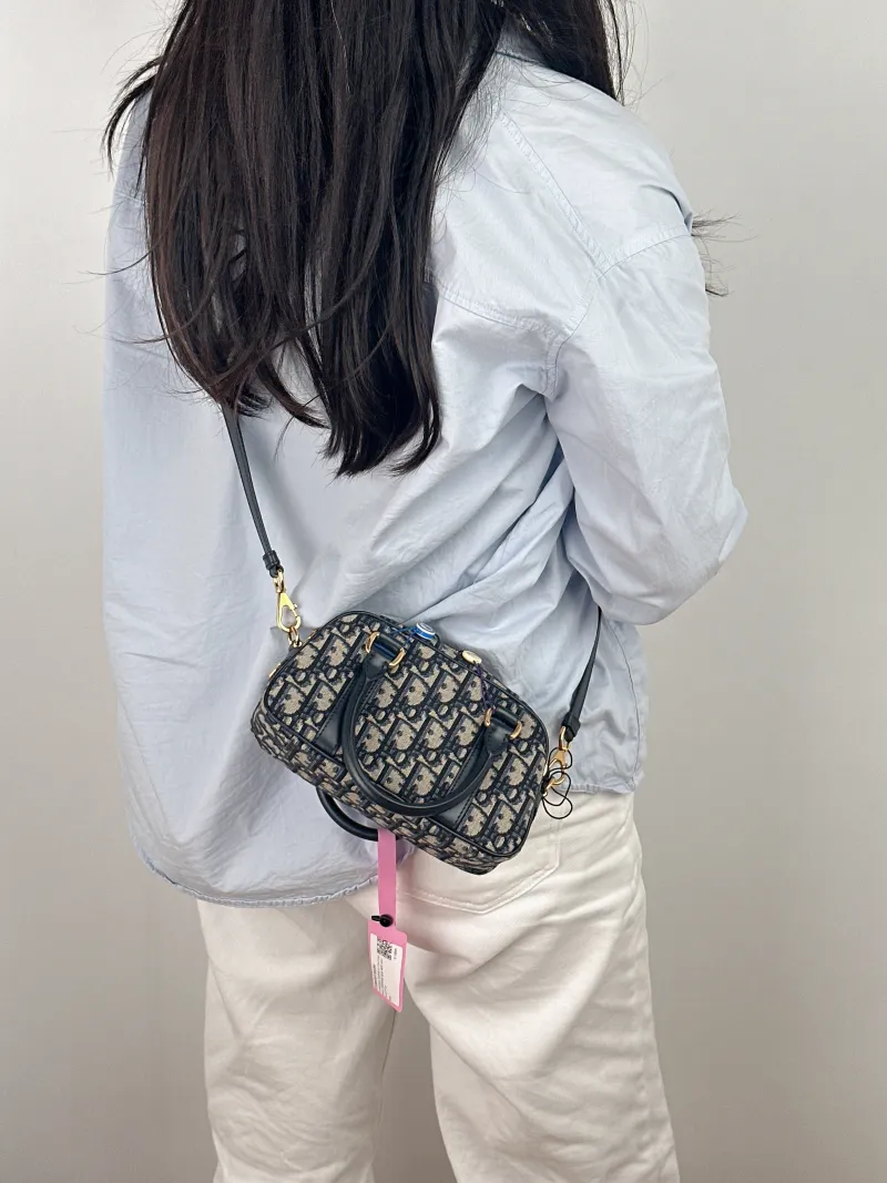 DIOR Crossbody Bag D-Vibe East-West Bowling Bag Blue Canvas Mini 20.5 × 7 × 12 cm — on-model view 1 of 2