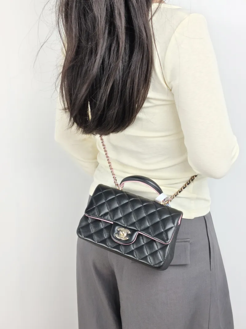 Chanel Crossbody Bag mini Black · Pink Lambskin mini 20 × 6 × 12 cm — on-model view 2 of 3