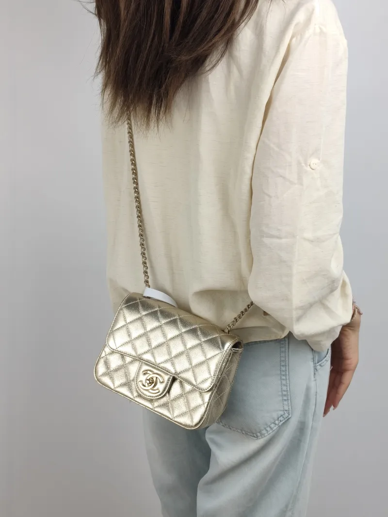 Chanel Crossbody Bag c Gold Grained Calfskin Mini 17 × 7 × 13.5 cm — on-model view 1 of 2