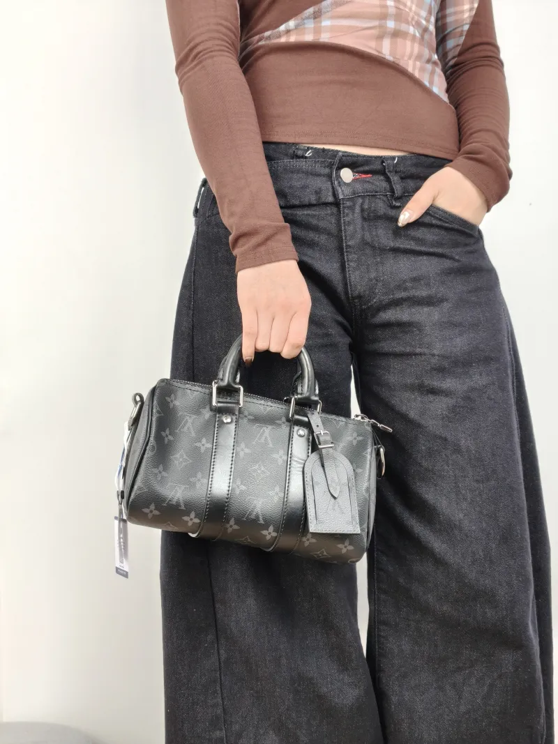 Louis Vuitton Crossbody Bag Keepall 25 PVC Medium 25 × 11 × 15 cm — on-model view 2 of 3