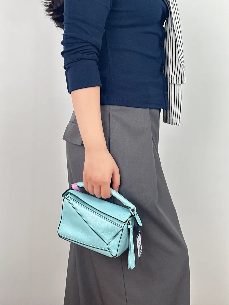 LOEWE Crossbody Bag Puzzle Blue Calfskin Mini 18 × 8 × 12.5 cm — on-model view 1 of 2