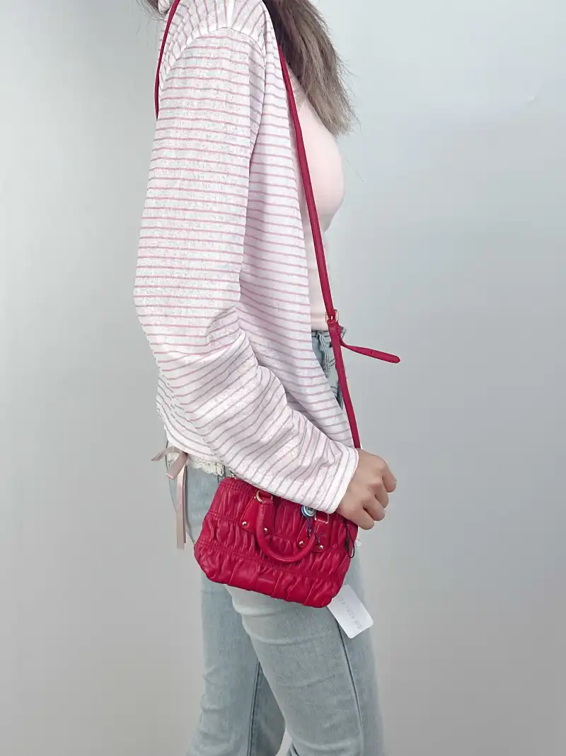 PRADA Crossbody Bag Messenger Bag Crossbody Bag Red Calfskinmini14 × 5 × 10 cm — on-model view 1 of 3
