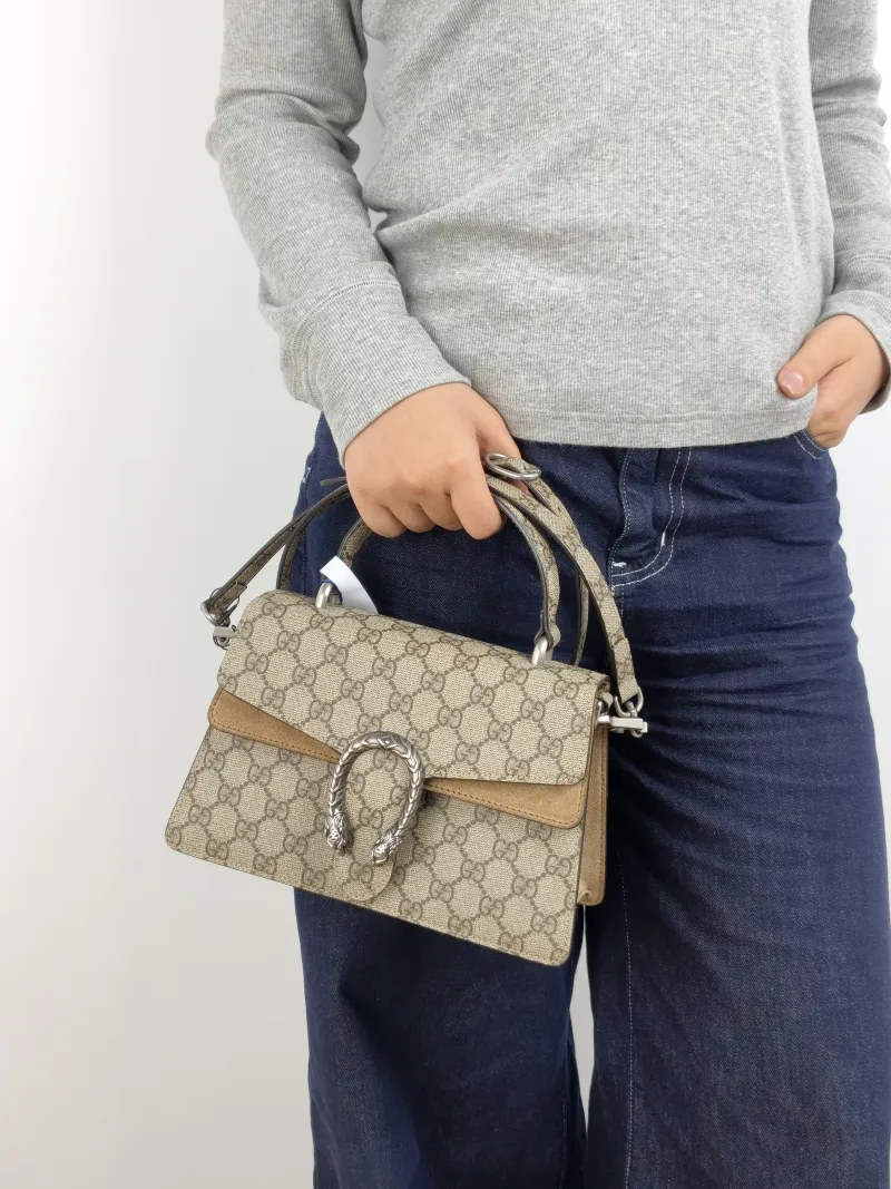 GUCCI Crossbody Bag Dionysus Edition Monogram PVC Small 24.5 × 10 × 15.5 cm — on-model view 1 of 3