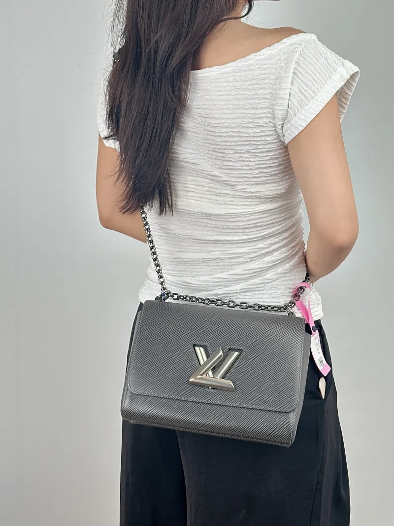 Louis Vuitton Crossbody Bag Twist Grey Calfskin Medium 23 × 9.5 × 17 cm — on-model view 2 of 2