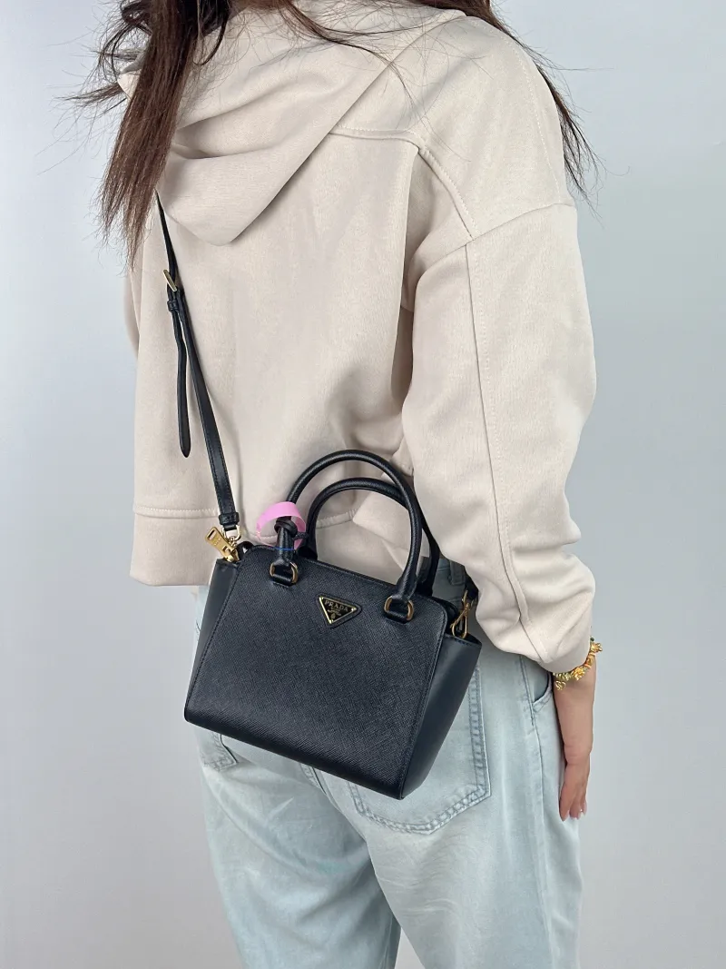 PRADA Top Handle Bag Tote Bag Black Calfskin Mini 18 × 9 × 15 cm — on-model view 1 of 2