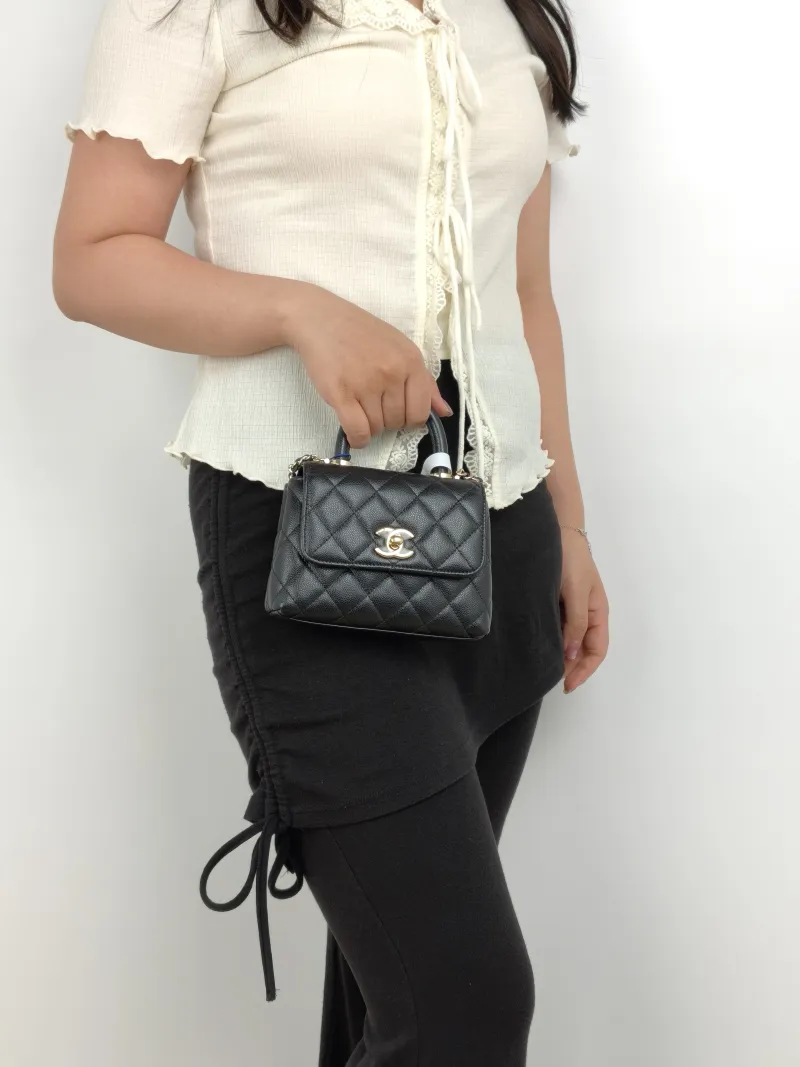 Chanel Top Handle Bag Coco Handle​Black Grained Calfskin Mini14.5 × 5.5 × 11.5 cm — on-model view 2 of 3