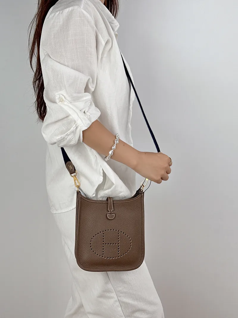 Hermès Crossbody Bag Evelyne Mini 16 Mini 1618 Taurillon Clemence TC Calfskinmini17 × 5.5 × 18 cm — on-model view 1 of 2