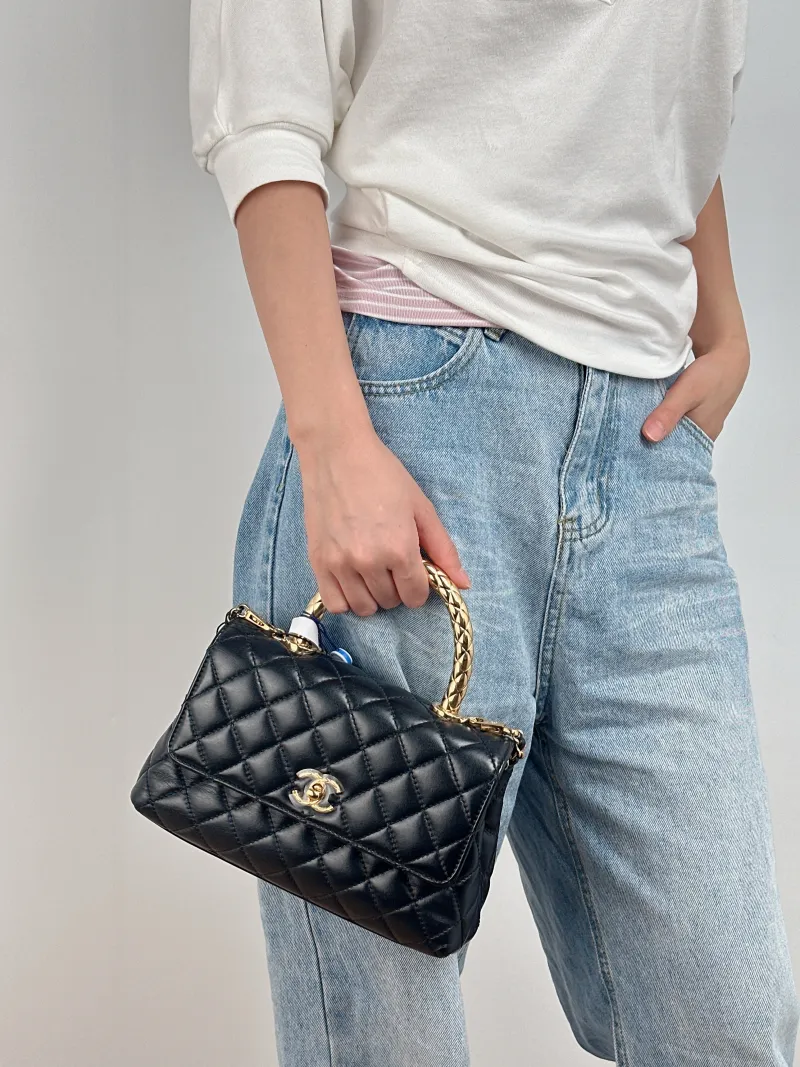 Chanel Crossbody Bag Coco Handle​Black Calfskin Small24 × 10 × 14 cm — on-model view 2 of 3