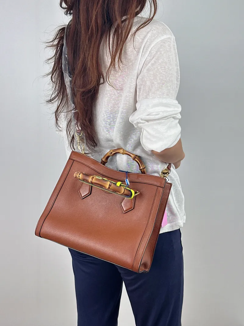 GUCCI Top Handle Bag Diana Top Handle Bag Caramel Calfskin Medium 27 × 10 × 24 cm — on-model view 1 of 2