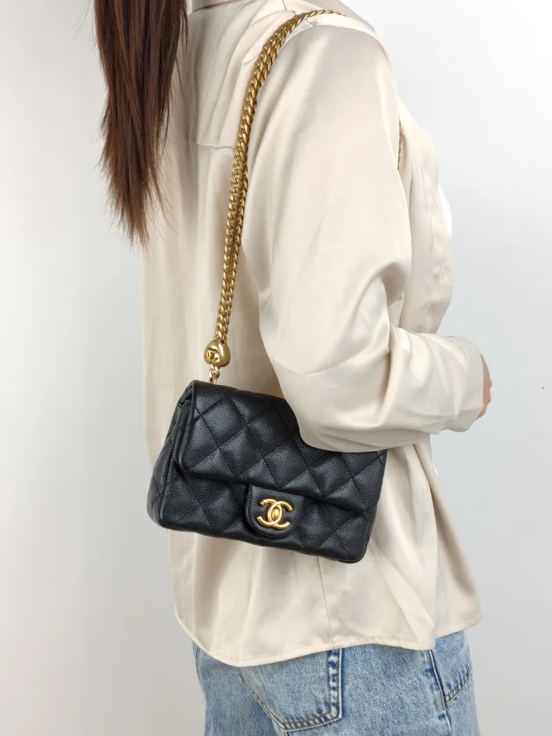 Chanel Crossbody Bag 23p Black Grained Calfskin 18 × 5 × 12 cm — on-model view 1 of 2